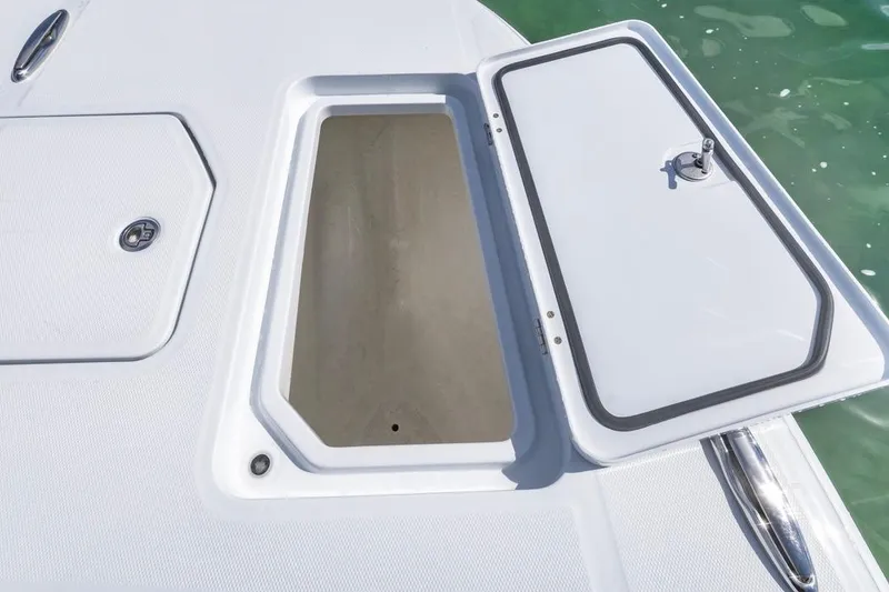 Slide: The Image of Open storage compartment on 2026 Invincible 33 Catamaran, showcasing sleek design and functionality. - 14