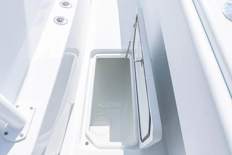 Slide: The Image of Open storage compartment on 2026 Invincible 33 Catamaran, showcasing sleek design and functionality. - 22