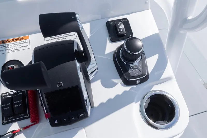 Slide: The Image of Control panel of 2026 Invincible 33 Catamaran with joystick and throttle controls. - 26