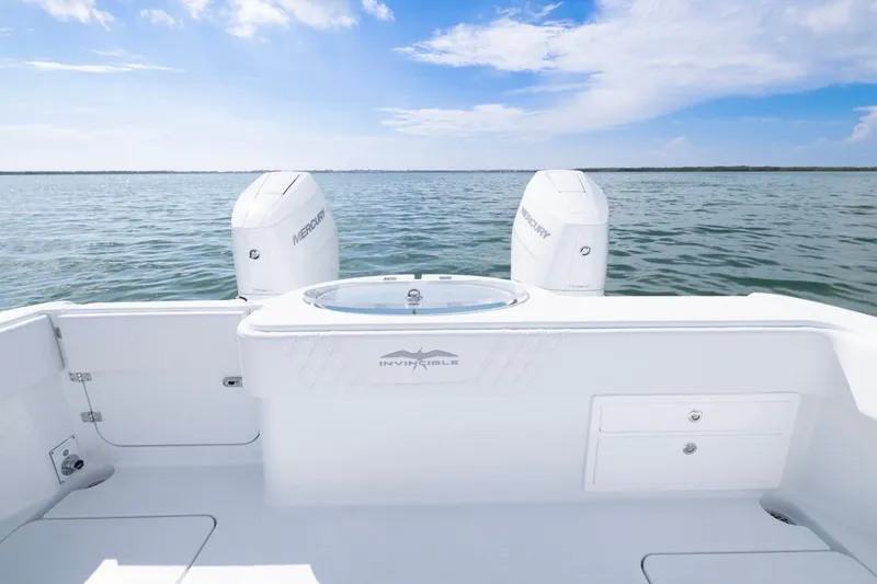 Slide: The Image of 2026 Invincible 33 Catamaran on open water, featuring dual Mercury engines. - 42