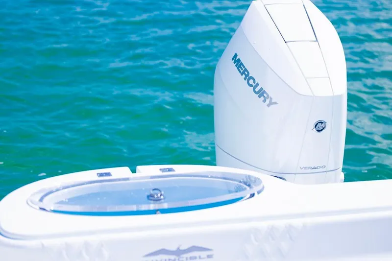 Slide: The Image of 2026 Invincible 33 Catamaran with Mercury Verado engine on blue water. - 46