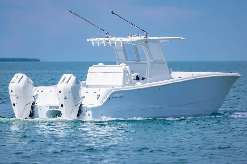 Slide: The Image of 2026 Invincible 33 Catamaran cruising on open water, showcasing sleek design and powerful engines. - 5