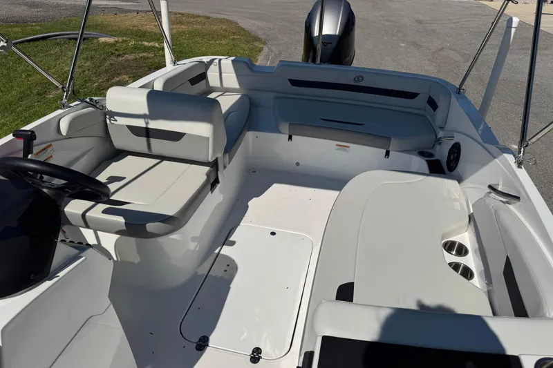 Slide: The Image of 2021 Hurricane SunDeck Sport 185 OB boat interior with seating and steering wheel. - 3