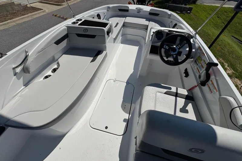 Slide: The Image of 2021 Hurricane SunDeck Sport 185 OB boat interior with seating and steering wheel. - 6