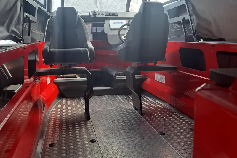 Slide: The Image of Interior of 2024 Stabicraft 2050 Supercab Sportfisher with red accents and modern seating. - 7