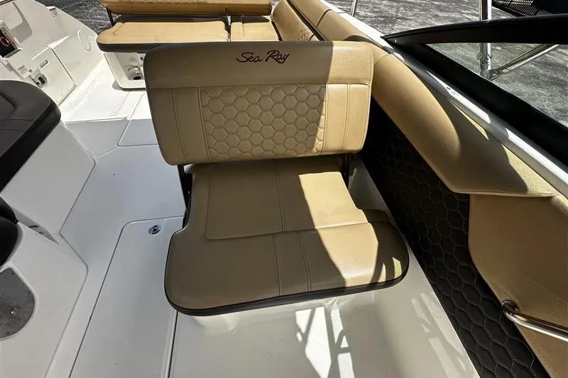 Slide: The Image of 2023 Sea Ray SDX 250 Outboard boat interior with tan leather seating. - 5