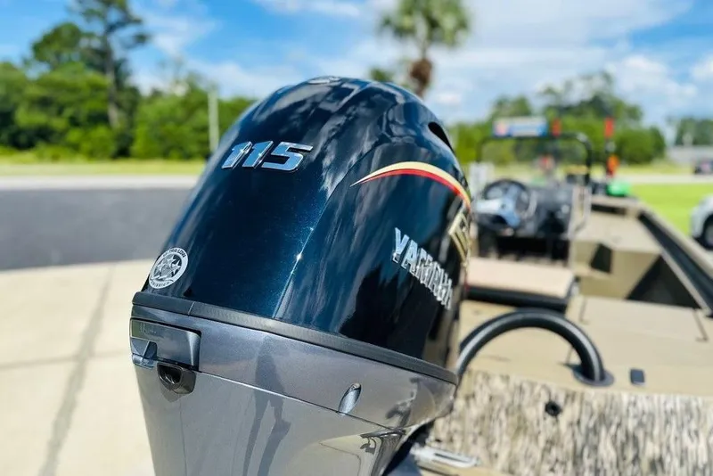 Slide: The Image of Outboard motor on a 2025 Thor 1900 Lake Hammer boat, sunny day background. - 9