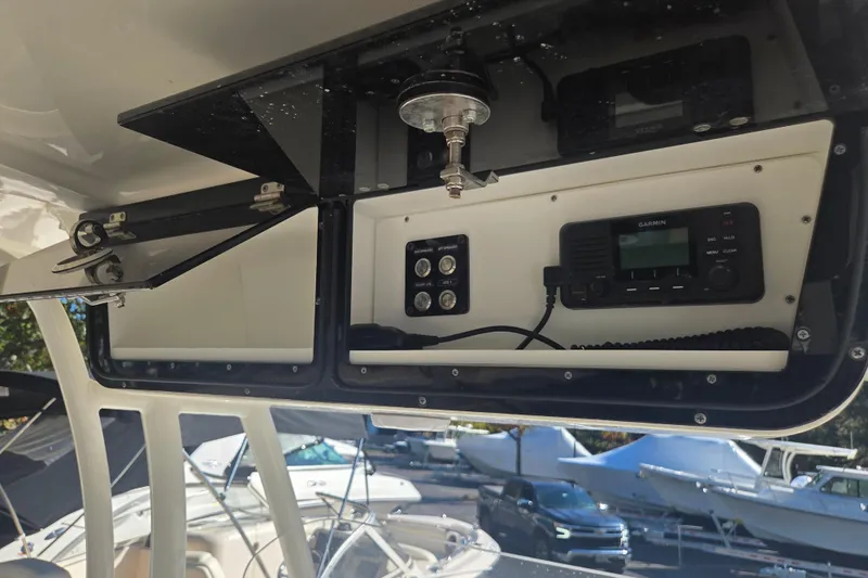 Slide: The Image of 2023 Key West 263 FS boat console with Garmin electronics and storage compartment. - 18
