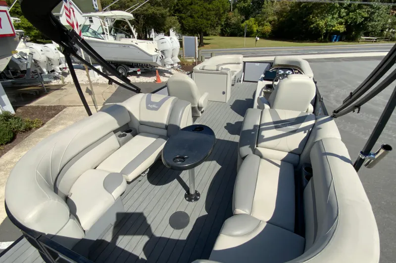 Slide: The Image of 2019 SunChaser Geneva Cruise 24 LR DH Sport pontoon boat with spacious seating and sleek design. - 10