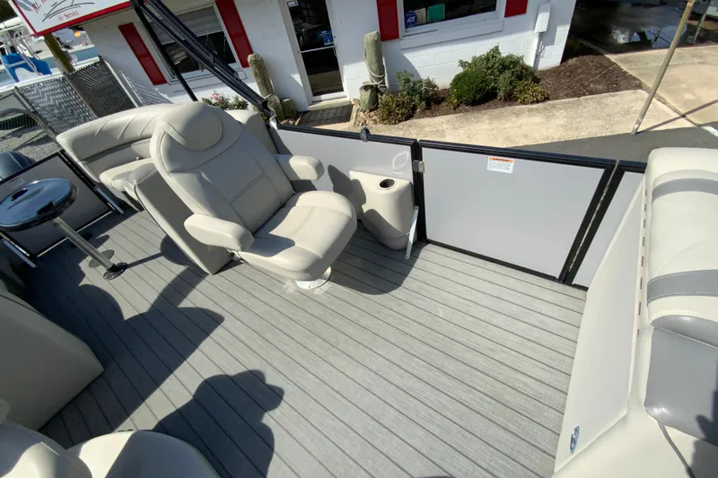 Slide: The Image of 2019 SunChaser Geneva Cruise 24 LR DH Sport boat interior with plush seating and sleek flooring. - 17