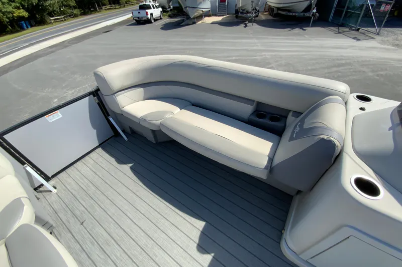 Slide: The Image of 2019 SunChaser Geneva Cruise 24 LR DH Sport boat interior with comfortable seating and cup holders. - 19