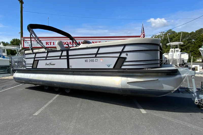 Slide: The Image of 2019 SunChaser Geneva Cruise 24 LR DH Sport pontoon boat on trailer. - 2