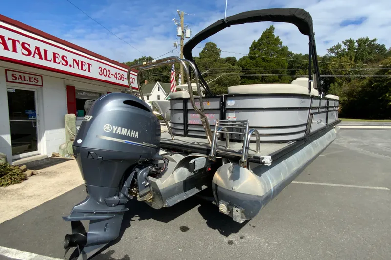 Slide: The Image of 2019 SunChaser Geneva Cruise 24 LR DH Sport pontoon boat with Yamaha engine at dealership. - 9