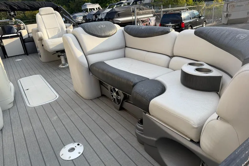Slide: The Image of 2020 Avalon 2385 Catalina Quad Lounger interior with plush seating and cup holders. - 7