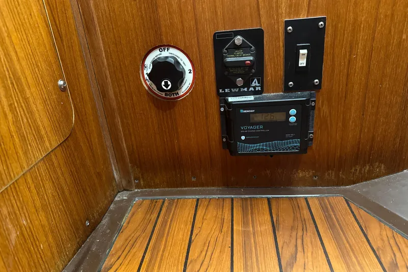 Slide: The Image of Control panel on 1985 Dehler 372 yacht with Renogy solar charger and Lewmar switch. - 22