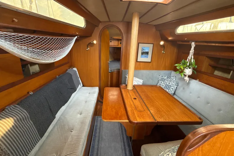 Slide: The Image of Interior of 1985 Dehler 372 sailboat with wooden table, seating, and decor. - 35