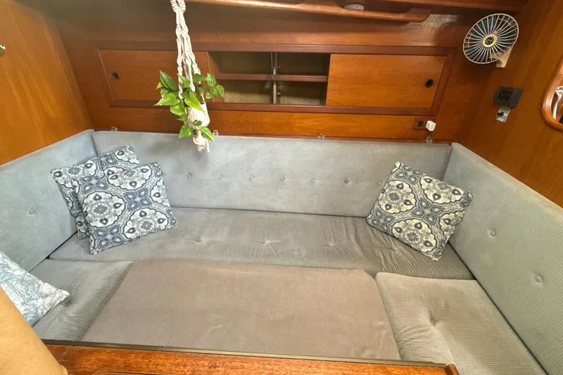Slide: The Image of Cozy interior of 1985 Dehler 372 sailboat with cushions and decorative pillows. - 42