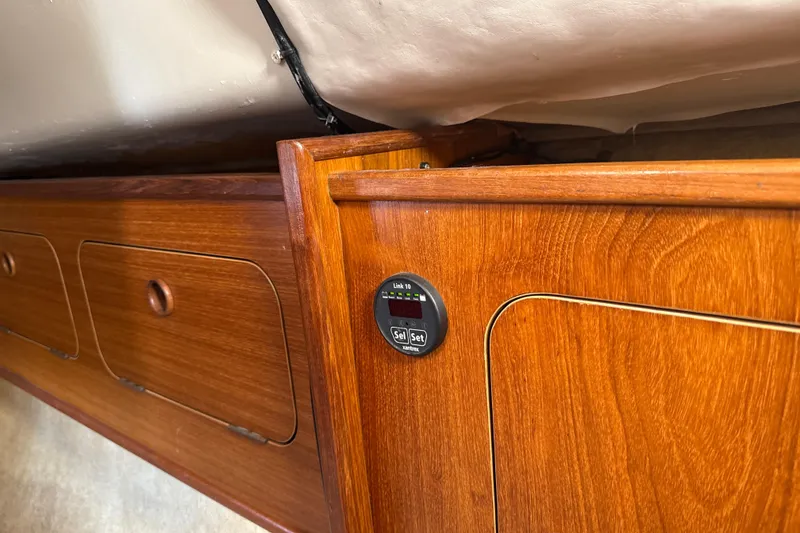 Slide: The Image of Interior of 1985 Dehler 372 yacht with wooden cabinetry and control panel. - 44