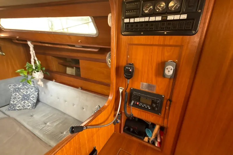 Slide: The Image of Interior of 1985 Dehler 372 sailboat with control panel and cozy seating area. - 9