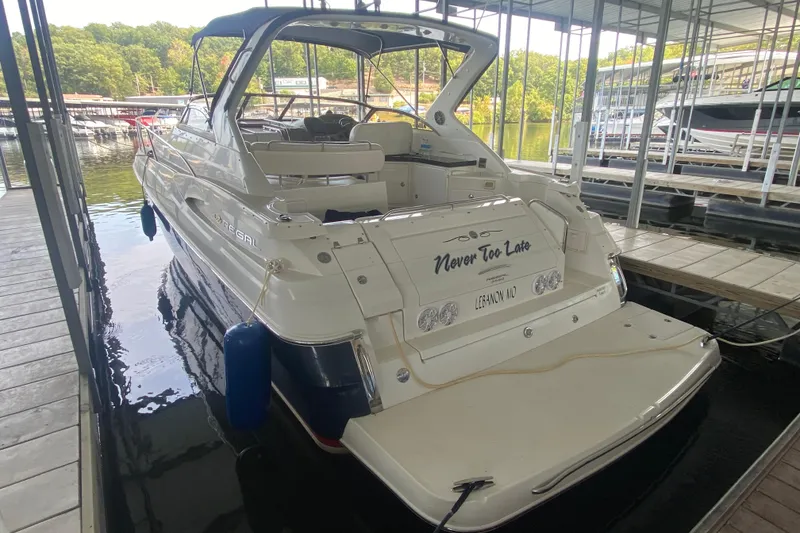 Slide: The Image of 2004 Regal Commodore 3560 boat docked, featuring "Never Too Late" on the stern. - 10