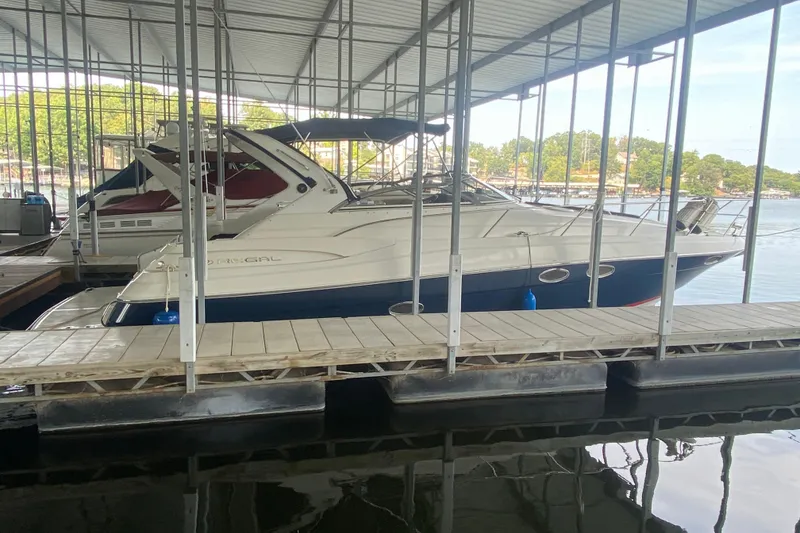 Slide: The Image of 2004 Regal Commodore 3560 yacht docked in a covered marina. - 12