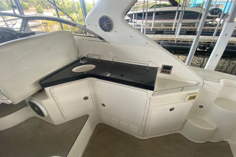 Slide: The Image of 2004 Regal Commodore 3560 yacht interior with sink and storage cabinets. - 16