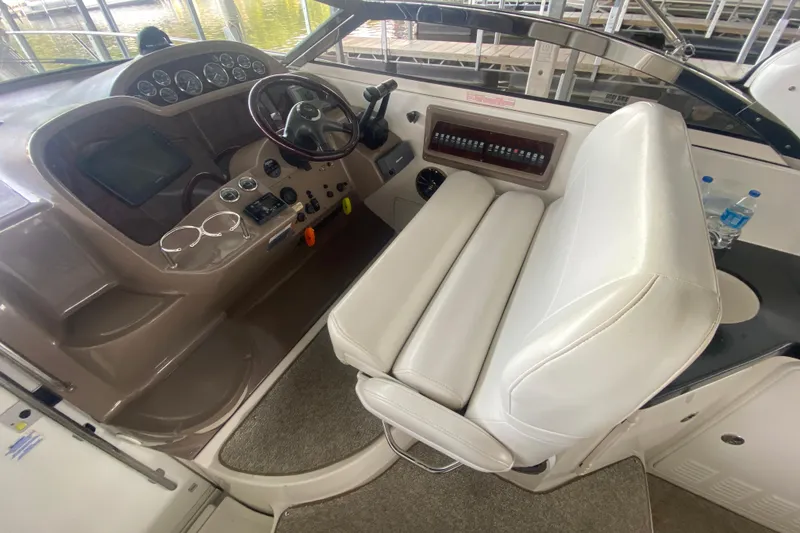 Slide: The Image of 2004 Regal Commodore 3560 helm with white seating and control panel. - 18