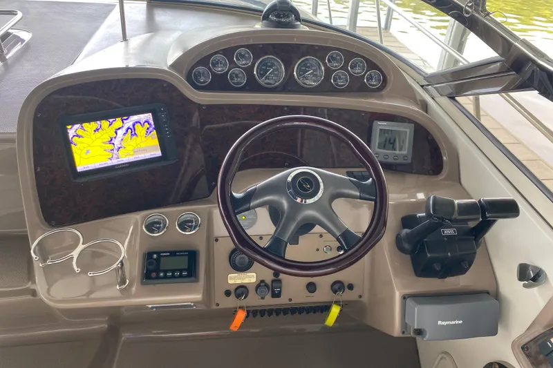 Slide: The Image of Control panel of a 2004 Regal Commodore 3560 boat with navigation equipment. - 22