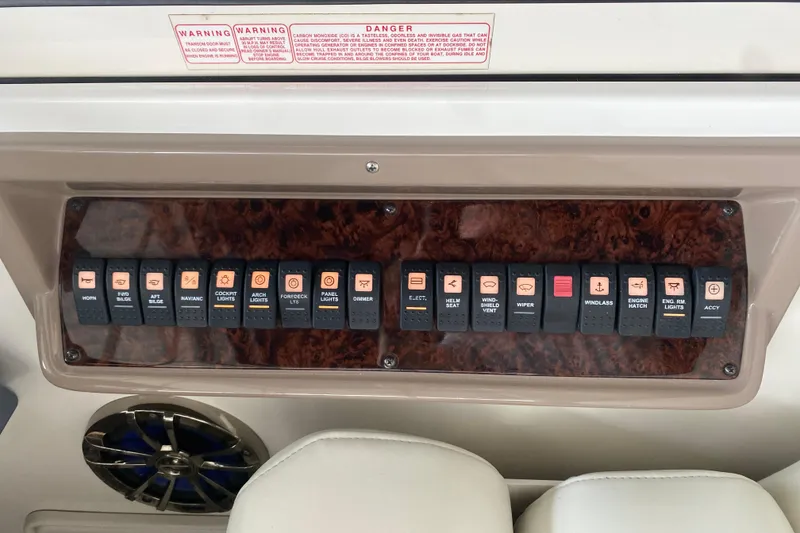 Slide: The Image of Control panel of a 2004 Regal Commodore 3560 boat with labeled switches. - 23