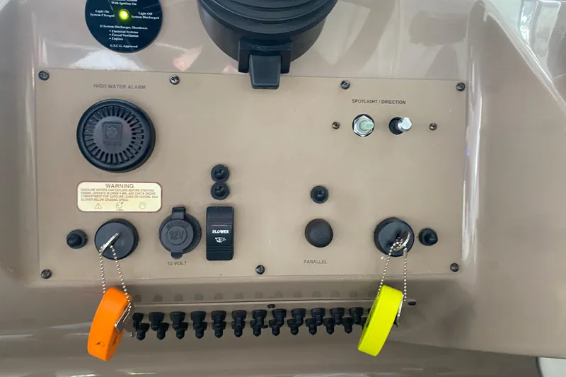Slide: The Image of Control panel of a 2004 Regal Commodore 3560 boat with switches and warning labels. - 24