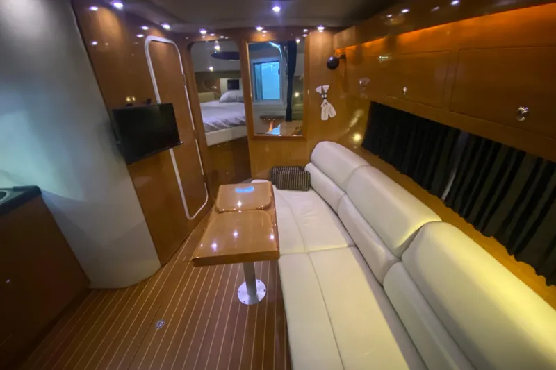 Slide: The Image of Luxurious interior of 2004 Regal Commodore 3560 yacht with leather seating and modern amenities. - 27