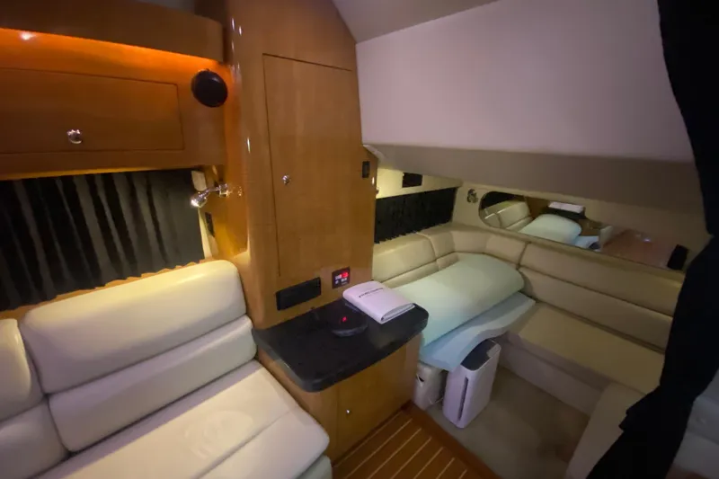 Slide: The Image of Luxurious interior of 2004 Regal Commodore 3560 yacht with plush seating and wood accents. - 30