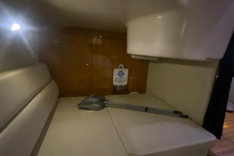 Slide: The Image of Interior cabin of 2004 Regal Commodore 3560 with seating and storage. - 32