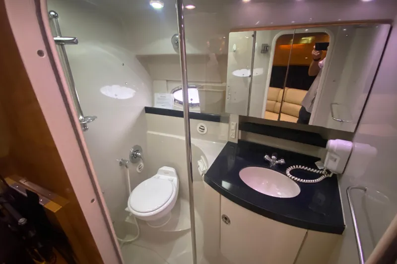Slide: The Image of Bathroom interior of 2004 Regal Commodore 3560 yacht, featuring modern fixtures and sleek design. - 33