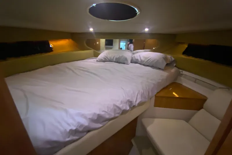 Slide: The Image of Luxurious cabin interior of 2004 Regal Commodore 3560 yacht with cozy bedding. - 34