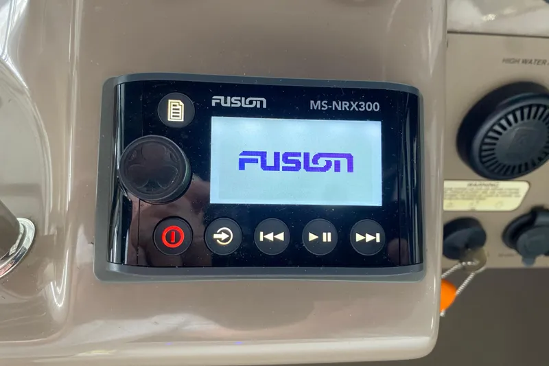 Slide: The Image of Fusion MS-NRX300 marine stereo on 2004 Regal Commodore 3560 dashboard. - 42