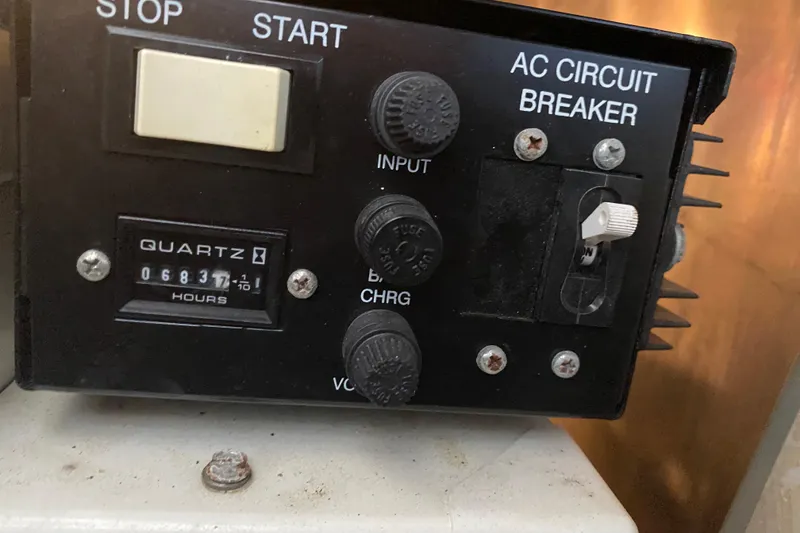 Slide: The Image of Control panel of a 2004 Regal Commodore 3560 with hour meter and circuit breaker. - 49