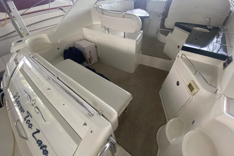 Slide: The Image of 2004 Regal Commodore 3560 boat interior with seating and storage areas. - 8