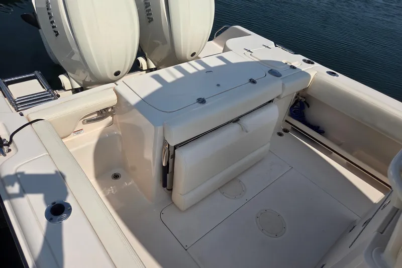 Slide: The Image of 2025 Grady-White Fisherman 257 boat deck with seating and twin Yamaha engines. - 11