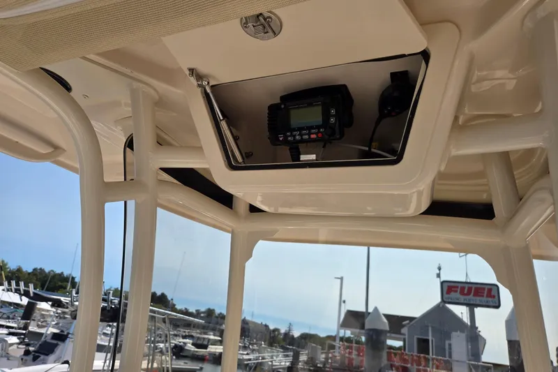 Slide: The Image of 2025 Grady-White Fisherman 257 boat console with electronic equipment at marina. - 14