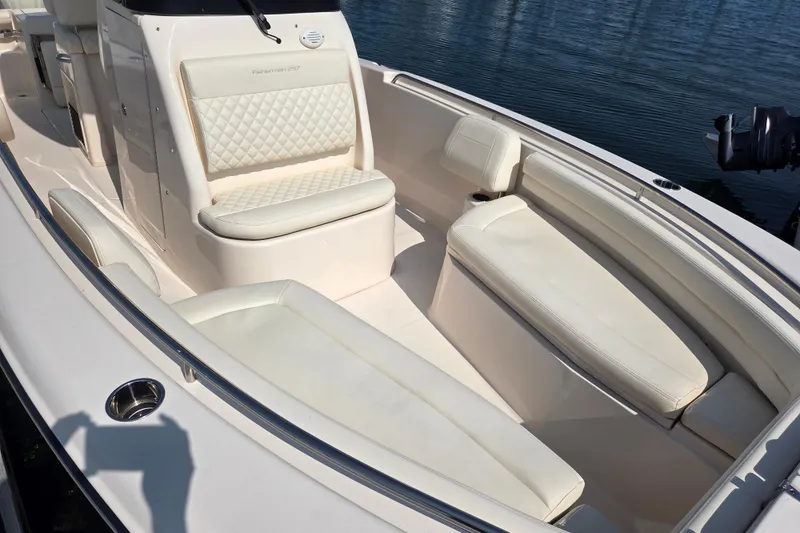 Slide: The Image of 2025 Grady-White Fisherman 257 boat interior with cushioned seating and sleek design. - 16
