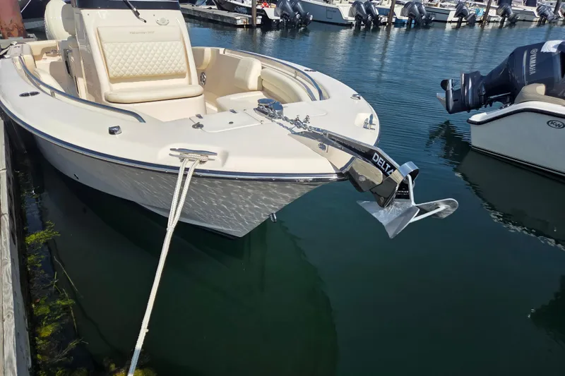 Slide: The Image of 2025 Grady-White Fisherman 257 boat docked with anchor, in a marina setting. - 17