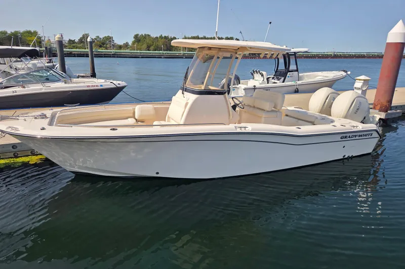 Slide: The Image of 2025 Grady-White Fisherman 257 boat docked in a marina, side view. - 18