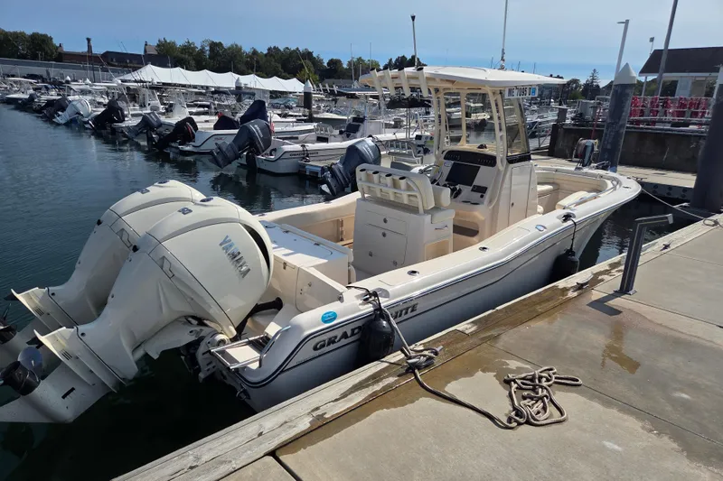 Slide: The Image of 2025 Grady-White Fisherman 257 boat docked with twin Yamaha engines. - 9