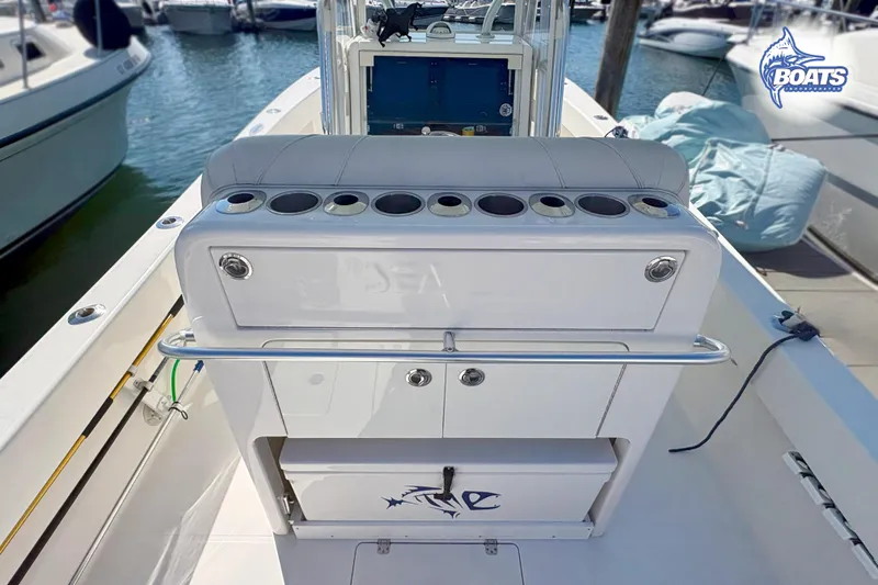 Slide: The Image of 2022 SeaVee 290B boat dashboard with dual Raymarine displays and steering wheel. - 10