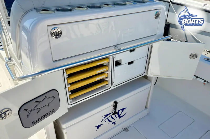 Slide: The Image of 2022 SeaVee 290B boat interior with rod holders and storage compartments. - 11