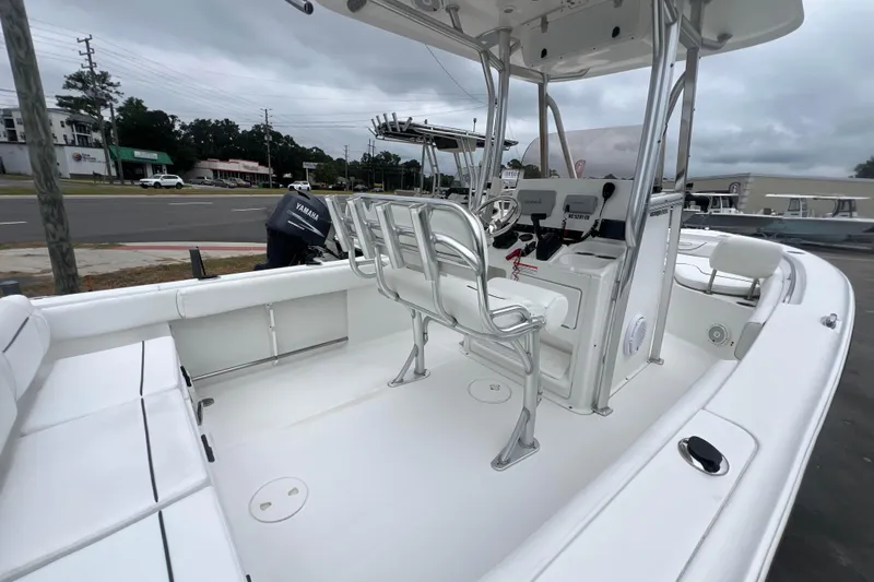 Slide: The Image of 2016 Sea Hunt Ultra 225 boat interior with seating and control console. - 13