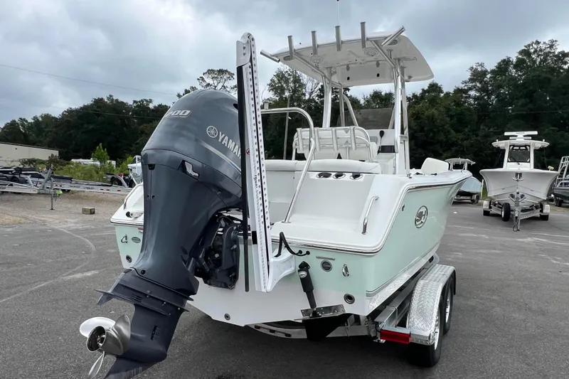 Slide: The Image of 2016 Sea Hunt Ultra 225 boat with Yamaha engine on trailer, parked outdoors. - 3