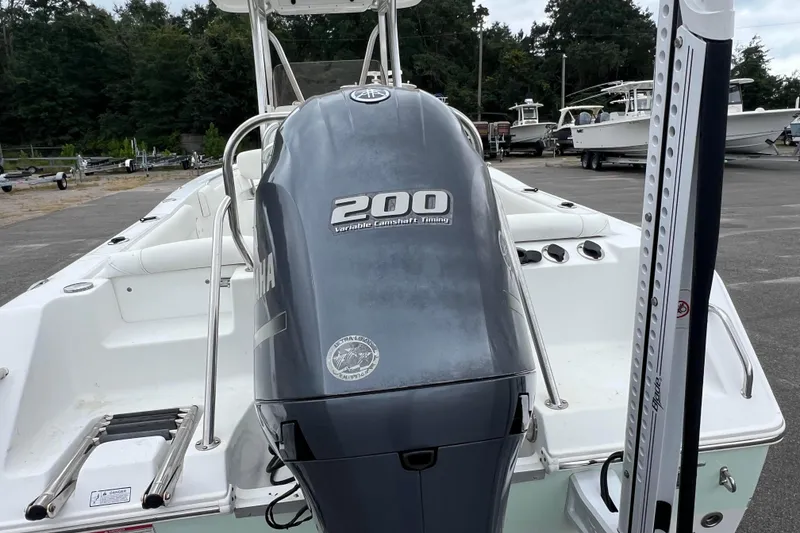 Slide: The Image of 2016 Sea Hunt Ultra 225 boat with Yamaha 200 engine, parked outdoors. - 4