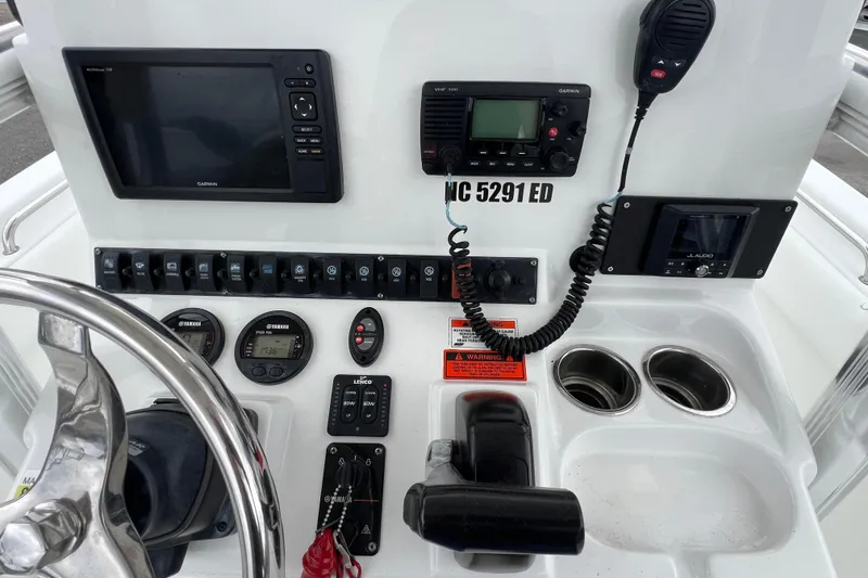 Slide: The Image of 2016 Sea Hunt Ultra 225 boat dashboard with Garmin electronics and Yamaha controls. - 9